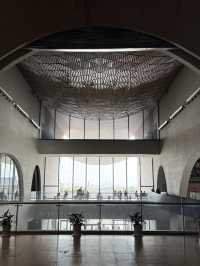 Stylish curvy Chinese museum about canal