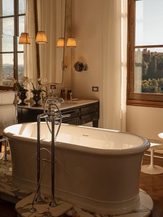 Exploring the magic of Fiesole and staying at Il Salviatino Firenze was next-level luxury, with stunning views and Tuscan vibes for days 🍷🌄

Top Spot to Visit:  
Il Salviatino Firenze (Via del Salviatino, 21) is THE place to stay if you want serious wow-factor. Think elegant rooms tucked into gardens, Instagrammable covered terraces, and Tuscan sunsets over Firenze’s hills. But here’s the real deal: the hotel’s dining experience is top-tier. The on-site restaurant serves local dishes and wine you can enjoy al fresco — it’s super romantic and super tasty.

Travel Insider Tips:  
Just a heads-up, while the food and atmosphere nailed it, some guests say room quality and service could be even better. If you want faster shuttles into Florence (the closest city center), ask at check-in; the hotel has shuttles but they’re not always frequent. Don’t miss their wine menu — it’s fresh, local, and pairs perfectly with the view.

Getting Around:  
Use the hotel shuttle for the easiest ride into Florence, but check for updated schedules so you don’t get stuck waiting! Alternatively, taxis or local buses are decent backup options.

Food & Drink:  
Besides the hotel restaurant, explore Fiesole’s cafes for authentic espresso and pastries. Dinner at Il Salviatino’s terrace is a must — reserve ahead for the best sunset seat.

Destination Hacks:  
Fiesole is safe, walkable, and ideal for relaxing. Pack light layers; evenings can get breezy. Bring euros for small purchases and tips.

#TuscanTravels  #FiesoleDreams  #LuxuryEscape 