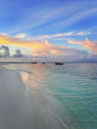 The sunset over the sea and the beach restaurant dinner at the Noku Resort in the Maldives are too romantic