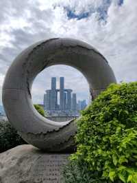 Doughnut Frames the Skyline: A Sweet Urban Snapshot