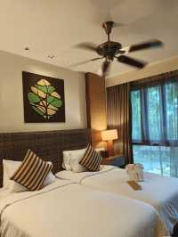 rainforest setting, over-water chalets, private beach, and friendly service