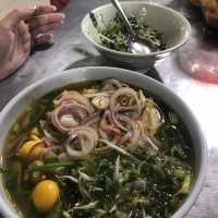 Local meal at Buon Ma Thuot market 