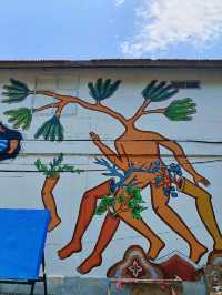 Citra Sasmita's enigmatic wall art at the Bali Kuta bus station.