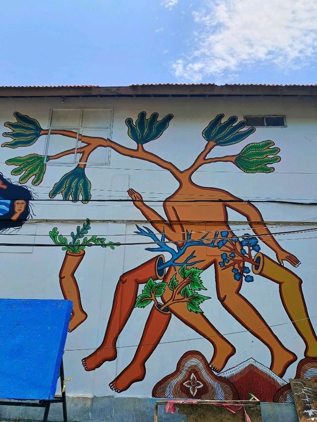 Citra Sasmita's enigmatic wall art at the Bali Kuta bus station.