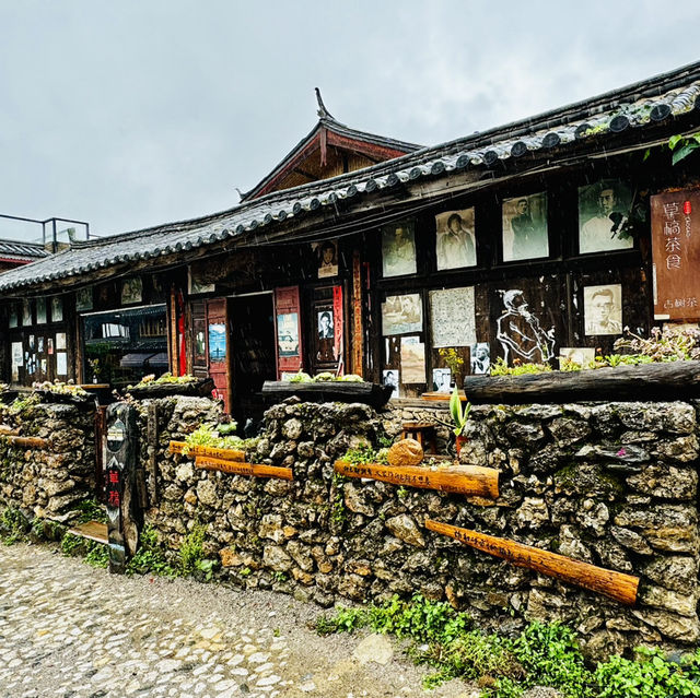Quaint stone village under Yulong Mountains
