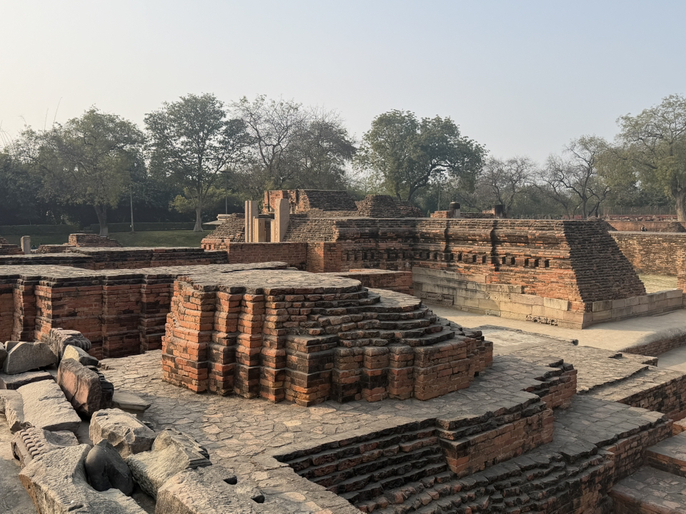 Varanasi isn’t just holy ghats and riverside rituals — if you want something a bit off the classic tourist path, Sarnath is the historic gem you need! 🕊️ Here’s my mini-guide to finding Buddha’s calm just outside the city. (Yes, it’s that place where Buddha himself gave his first sermon!)

Top Spots to Visit:
1. Archaeological Buddhist Remains of Sarnath (92JF+42H, Rishpattan Rd, Sarnath)  
Open Tue–Sun, 8am–6pm. Walk among ancient ruins and lush gardens where the past feels super alive. Pro tip: Early morning or sunset, when the light hits the stupas, is total photo magic.  
2. Ashoka Chakra – Spot this national symbol marking the spot’s importance in Indian history.  
3. Dharmarajika Stupa (92JF+C52, Sarnath)  
Open Mon–Thu, Sat–Sun, 10am–5pm. Peaceful, less crowded, and genuinely atmospheric. Let the silence do the talking.

My Tips:
· Sarnath is super close to Varanasi, barely 10km away, and a tuk-tuk or auto-rickshaw will get you there fast (bargain on the price!).
· Even if it gets cloudy, the parks and stupas have a calm vibe for a rainy-day walk.  
· Pack light snacks and water, since food options inside are pretty limited.

Getting Around:  
Auto-rickshaws or Ola cabs are your best bet from Varanasi. Bike rentals are possible if you’re feeling adventurous and want more freedom.

What/Where to Eat:  
Grab chai or local snacks near the main entrance—the momos and samosas are simple but hit the spot.

Useful Destination Tips:  
Carry small change (many vendors don’t have cash apps), and dress respectfully for religious sites.

#Sarnath #VaranasiDiaries #BuddhistHistory #IndiaTravel #TravelWithtripcom