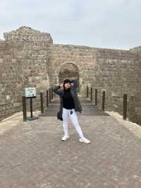 “Whispers of the Past: The Timeless Walls of Bahrain Fort”