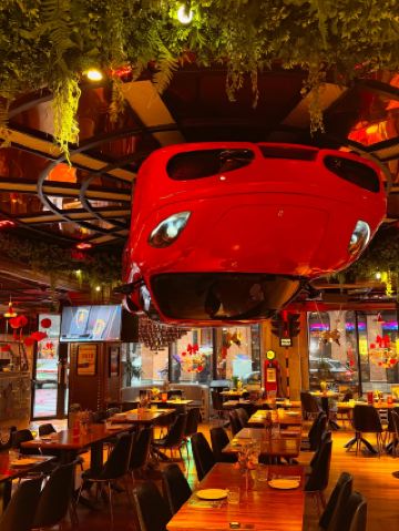 Spend an afternoon sitting in a Ferrari suspended overhead on the Bund 30, having lunch