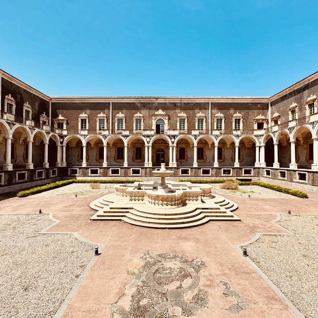 A Solo Traveller’s Retreat: Benedictine Monastery of San Nicolò l’Arena** 🏰