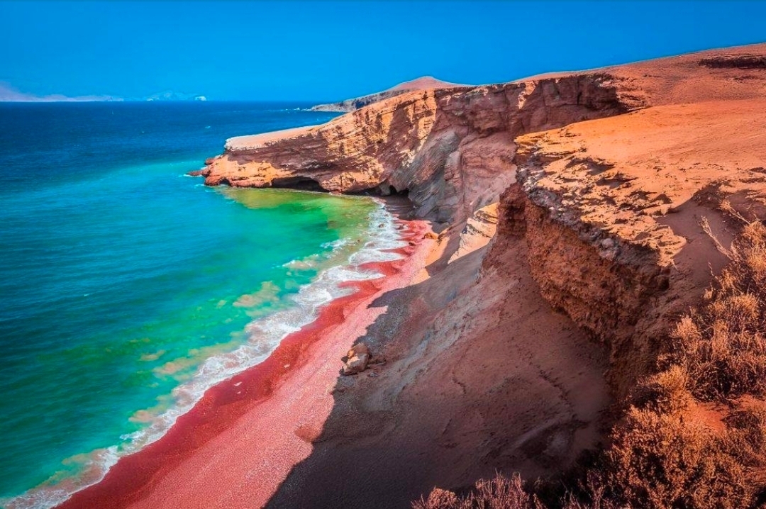 Paracas National Reserve 🇵🇪 — Where the Desert Meets the Ocean

Imagine a place where golden desert cliffs meet the deep blue Pacific Ocean, where dramatic coastlines stretch toward the horizon, and where nature paints the landscape in shades of red, gold, and turquoise. Welcome to Paracas National Reserve, one of Peru’s most extraordinary coastal destinations.

Located in the Ica Region of southern Peru, this remarkable reserve is famous for its striking desert scenery, rugged cliffs, beautiful beaches, and rich marine ecosystem. One of its most distinctive attractions is Playa Roja (Red Beach), where reddish sand creates a spectacular contrast with the blue ocean and surrounding golden landscape.

Beyond its breathtaking views, Paracas is home to fascinating wildlife, including seabirds, sea lions, and other marine species. Visitors can explore scenic coastal viewpoints, photograph unusual geological formations, and experience the peaceful beauty of Peru’s desert coastline.

The cooler coastal months and sunny winter season can offer pleasant conditions for sightseeing, although wind and weather may vary. Bring sunscreen, sunglasses, water, and a light jacket, as the coastal breeze can be surprisingly strong.

Paracas National Reserve is a wonderful reminder that beauty exists in the most unexpected combinations. If you love dramatic landscapes, unusual beaches, and unforgettable travel photography, this destination deserves a place on your Peru bucket list. 🌊🏜️

📍 Location: Paracas National Reserve, Ica Region,Peru  

  #Paracas  #Peru  #PlayaRoja  #RedBeach  #PacificOcean  #DesertLandscape #travel2026 #naturalwonders #travel #thingstodo  #SouthAmerica  #NaturePhotography  #HiddenGems  #TravelMoments 