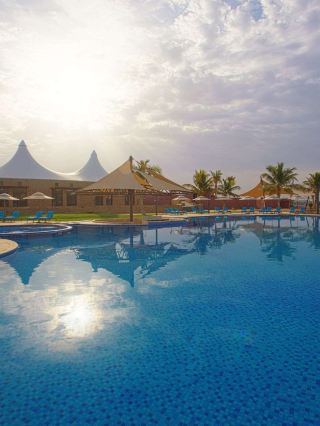 🌟 Sharma's Serene Stay: Royal Tulip Resort Revealed! 🏖️