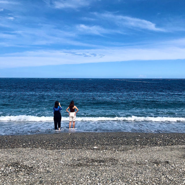 Escape to the pristine shores of Qixingtan Beach, where the mountains kiss the ocean