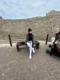 “Whispers of the Past: The Timeless Walls of Bahrain Fort”