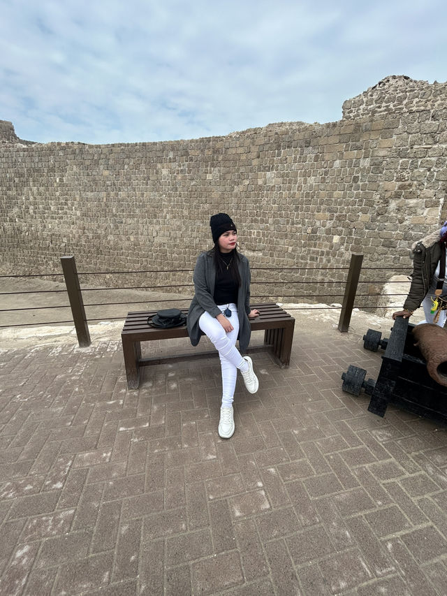 “Whispers of the Past: The Timeless Walls of Bahrain Fort”
