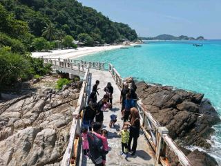 Serene Paradise Awaits at Redang Island 🌴💧🌅  
Step into a world of crystal-clear waters and powdery white sands—Redang Island is a tranquil haven you won’t forget! The genuine warmth of the islanders makes every moment here feel like a hidden escape. ✨  

🛶 Recommended Route:
Take a ferry from Kuala Terengganu straight to Pulau Redang, arriving at the main jetty. From there, stroll to your resort, then head for the seashore at sunrise for unrivaled calm and the gentle sound of waves.  

🏊 Must-Do Experiences:
- Go snorkeling around Tanjung Tengah or Pasir Chagar Hutang for mesmerizing coral and vibrant fish (best in the early morning).
- Lounge on Teluk Dalam Beach where peace truly reigns.
- Try kayaking or a chill stand-up paddleboard session.
- Enjoy sunset at Pantai Pasir Panjang—the golden hour here feels magical!  

📸 Insta-Worthy Spots:
- Capture wide shots at the sandbar in front of Laguna Resort—perfect mirror reflections!
- Snorkel with a waterproof camera for underwater reef pics.
- Sunset silhouettes at Pasir Panjang Beach.  

🔍 Practical Tips:
- The island is open only Mar 1–Oct 31, so plan accordingly.
- Resorts can help arrange tours or snorkeling gear—ask early for better rates.
- Mosquitoes can be fierce at dusk; pack repellent!
- Evenings are quiet, ideal for stargazing.  

⚠️ Precautions:
- No ferries during monsoon closure (Nov–Feb); check dates before booking.
- Beware of strong midday sun—safe hours are before 10am and after 4pm.
- Stick to marked swimming zones for safety.  

#RedangIsland #MalaysiaTravel #PeacefulEscape #BeachVibes  #naturalwonders #travel #familytravel #staycation 