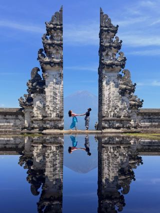 Bali has a gate that looks like it opens straight into the sky. 🇮🇩✨

📍 Gate of Heaven: Lempuyang Temple

If you’ve ever seen those dreamy Bali photos with two massive temple gates framing Mount Agung, there’s a good chance you’re looking at Lempuyang Temple, one of the island’s most recognisable cultural landmarks.

The famous “Gate of Heaven” isn’t just about getting the perfect photo. Lempuyang is a Hindu temple complex with deep spiritual significance, and the journey there is part of the experience.

Located in East Bali, the temple sits high in the mountains, surrounded by dramatic landscapes and cooler air compared with the coast. On a clear morning, the view toward Mount Agung can be incredible, especially when the clouds cooperate.

And that’s the catch. 👀

That perfect mountain view isn’t guaranteed.

Clouds can completely cover Mount Agung, weather can change quickly, and the atmosphere can look totally different from one morning to the next. So if you’re visiting mainly for the famous photo, keep your expectations flexible.

🌄 GO EARLY

Lempuyang is one of those places where an early start can make a huge difference.

Morning generally gives you better light and can feel more peaceful before the area becomes busier.

Bring water, wear comfortable shoes and give yourself plenty of time because reaching the temple involves stairs and walking.

🛕 REMEMBER THIS IS A TEMPLE

The Gate of Heaven might be famous on social media, but Lempuyang remains an important Hindu religious site.

Dress respectfully, follow the temple’s rules, cover your shoulders and knees where required, and be mindful when ceremonies or prayers are taking place.

The photo is a memory.

The temple is the actual place.

📸 FOR THE PHOTO

If you want that iconic composition, the symmetry of the gates is what makes the scene so recognisable.

But don’t spend the entire visit chasing one shot.

Look beyond the gate.

Notice the traditional architecture, mountain landscape, temple details and atmosphere around you.

Sometimes the photo you didn’t plan ends up being your favourite.

And if Mount Agung appears between the gates?

That’s just the Bali bonus. 😂🏔️

🇮🇩 MAKE IT AN EAST BALI DAY

Lempuyang works well as part of a wider East Bali itinerary.

You can combine it with places such as Tirta Gangga, Taman Ujung, scenic rice fields and coastal areas around Amed.

That way, you’re not travelling all the way east for one photo and immediately turning around.

Take your time.

East Bali has a much slower atmosphere than some of the island’s busiest tourist areas, and that’s part of its charm.

Would you wake up early for this view? 👀🏔️

📍 Gate of Heaven, Lempuyang Temple, Bali 🇮🇩

📸 @malaysian_diaries

#Bali #LempuyangTemple #GateOfHeaven #EastBali #BaliTravel #BaliIndonesia #IndonesiaTravel #BaliPhotography #TravelPhotography #BaliGuide #ExploreBali #TravelInspiration #VisitBali #TravelMoments #Wanderlust