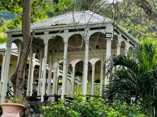 #winterescape 🌴 Caribbean Charm Meets Colonial Spirit at Road Town’s Tortola Pier Park 🍹🧱  
Immerse yourself in tropical history and vibrant culture at Cyril B. Romney Tortola Pier Park—a must-see highlight right in the heart of Road Town! With its fusion of ancient stone architecture, bustling shops, and a family-friendly rum distillery backdrop, this spot serves up both tradition and modern flair in one breezy stroll.

🗺️ Easy Itinerary & Must-Dos:  
Start your adventure by exploring the open-air market and unique boutiques housed within charming colonial-style buildings. Don’t miss the chance to tour the famous local rum distillery—kids will love peeking at the huge barrels and old wooden doors while adults can sample a taste of the Caribbean spirit.  

📸 Insta-Worthy Angles:  
Snap photos near the distillery entrance for a picture-perfect contrast between lush tropical trees and timeworn stone walls, or capture family moments alongside the sleek modern storefronts set against Tortola’s blue skies. The outdoor cultural landscape is especially photogenic, so don’t forget close-ups of the rustic architecture and vibrant community life.

🕔 Practical Tips:
Pier Park is open Monday–Saturday, 9:00 AM–6:00 PM, and remains lively year-round. Arrive early to enjoy quieter strolls and cooler morning air—perfect if you’re visiting with children. Stay hydrated, wear light clothing, and bring a sun hat, as the Caribbean sun gets intense fast.

⚠️ Key Precautions:
Keep an eye on little ones near historic structures—some stone walls can be uneven. The area is generally safe, but watch out for busy crowd spots especially on cruise arrival days.

#BritishVirginIslands #Tortola #RoadTown #CaribbeanCulture #FamilyTravel