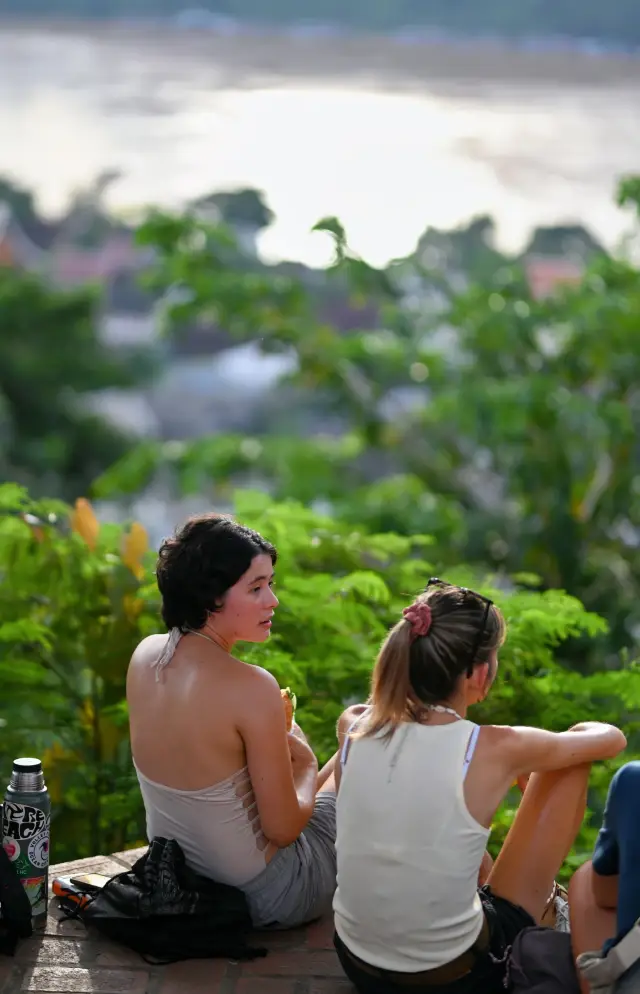 At the peak of Luang Prabang, witness an equatorial sunset.