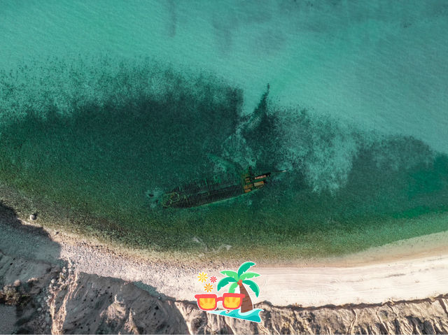 Secret beach with a shipwreck 