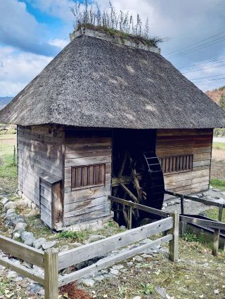 Yamaguchi Waterwheel is a charming thatched‑roof mill