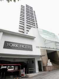 “The York Hotel: Where Comfort & Convenience Steps from Orchard”