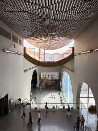 Stylish curvy Chinese museum about canal