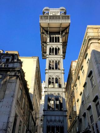 Take the most beautiful elevator ride to overlook the cityscape of Lisbon: Santa Justa Elevator.