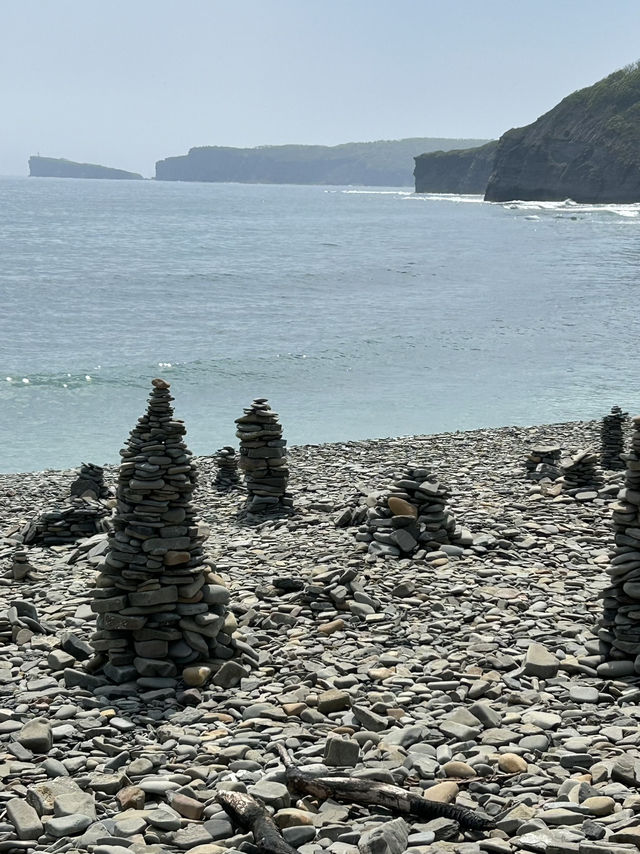 A beach full of small pyramids 