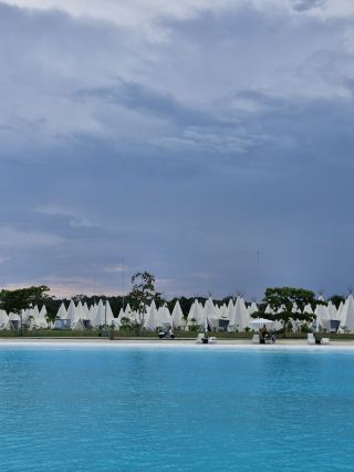 Just got back from an ultra-chill anniversary trip to Bintan, and honestly? The ANMON Resort totally lives up to its hype 🌴✨. Think striking resort vibes, dreamy lagoon views, and a whole menu of water sports at Treasure Bay — plus pasta, fries, pizza, and milkshakes at the Compass Rose for your IG feed. We went in July for our 1st anniversary and scored that dreamy “quiet period,” so it felt like we had the whole place to ourselves!

Top Spots to Visit in Bintan:
1. The ANMON Resort Bintan — Kawasan Pariwisata, Jl. Raja H. Fisabililah No.88, Sebong Lagoi. Their tents are super comfy (the air conditioning is a lifesaver!) and staff are incredibly welcoming.
2. Treasure Bay Attractions — Treasure Bay Bintan, Jln. Raja Haji KM 01 Tourism Area. Open daily 09:00–18:00, IDR 45,000 entry. Don’t miss their kayaking and the famous Slip and Slide (585J+MG Sebong Lagoi): both are epic for adrenaline and photos.
3. The Compass Rose & Tipi Bar — Located right within ANMON. The pizza, milkshake, and fries combo is legit perfect for refueling after a day of adventure.

Pro Tip: If mangrove night tours are on your list, LAYER that mosquito repellent like your life depends on it! I skipped and ended up as the mosquitoes' buffet — so don’t be me 😂.

Getting Around: Resort shuttles and scooters make moving between attractions easy, though outside amenities are limited so plan most meals and activities on-site.

Quick Advice: Bring extra snacks, sunscreen, and make sure your room faces the lagoon for sunrise magic. Bintan is visa-free for many countries, but check your passport rules before you go!

#BintanFun #LagoonViews #TheANMONResort #TravelTips #Tripdotcom #bintan 