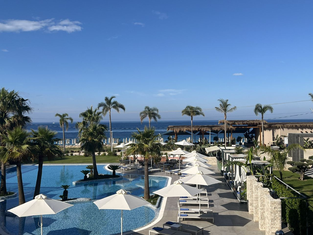 Dreaming of a luxe getaway on the Albanian Riviera? Vlore’s Miamar Luxury Hotel & Spa shines for travelers craving relaxation, scenery, and a splash of indulgence. 💎 This hotel is perched right on the sands of Livadhi Beach, letting you drift between your plush room, the private beach and club, a sparkling pool, and a wellness oasis—all in one chic package.

Upon arrival, you’ll feel the vibe: sun-soaked terraces, stylish lounges, and easy access (about 15 minutes by taxi from central Vlore). The real magic? There’s a world-class sauna and spa perfect for morning sessions or sunset unwinding. The outdoor pool—bordered by palms and with views of the turquoise coastline—is totally insta-worthy. 📸 Don’t miss golden hour by the water for that picture-perfect shot!

Start your day right: the breakfast spread is legendary, ranging from local cheese and dreamy pastries to fresh fruit and hot-off-the-griddle options. It’s the ideal fuel before exploring the nearby Himara village or old city of Vlore.

A few tips: splurge on a sea-view room—the sunsets are unreal. Book your beach club cabana early on weekends, it’s popular with locals. And definitely pencil in a spa appointment (the massage therapists here are top-notch).

Pro tip: For the best rates, book your room in advance on trip.com, since Miamar tends to fill up fast in peak season.

If you can tear yourself away, add a stroll along Vlore’s promenade or a day-trip to Llogara Pass for jaw-dropping views.

#Vlore  #LuxuryHotel  #BeachGetaway  #TravelTips  #AlbanianRiviera 