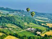 Hot air balloon ride above from Toscany sky 