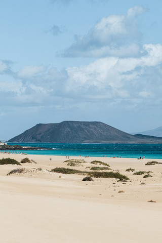 A scenic encounter where volcanoes meet the sea!