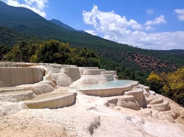 BaiShuiTai Landform: Where Turquoise Water Meets Deep Blue Sky