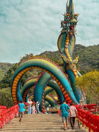 Visit Wat Tham Chang and pay homage to the largest Naga statue in Thailand.