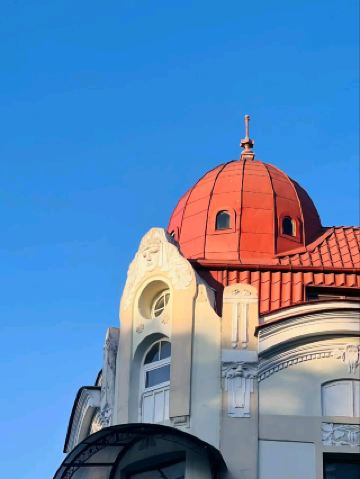 #winterescape ☂️ Strolling Under Colorful Skies at Varna Beach, Odesos 🌊

Varna Beach in Odesos is where urban vibes blend perfectly with sunny shores and playful surprises. Don’t miss the whimsical umbrella art installation—a vibrant splash of color against the sky that’s pure Insta-magic!

Start your day with a breezy walk along the promenade. The umbrella canopy is especially striking around midday when the sunlight pours through, casting bright shades and shadows perfect for photos. Snap your best shot with the clear blue or dramatic cloudy sky as a backdrop—try angling up for a creative building close-up, capturing both Western-style architecture and the joyful canopy above.

After exploring the installation, dip your toes in the Black Sea or rent a sunbed for pure relaxation. The seafront cafés offer Bulgarian snacks and coffee—grab a table with a view and enjoy people-watching alongside the salty breeze. If the clouds roll in, the umbrellas still look charming—just have a light rain jacket handy (Varna weather can switch up fast!).

Tip: Visit early morning for fewer crowds and softer lighting, or stick around till sunset for golden-hour shots against the colorful umbrellas. Watch your step; the tiled walkways can be slippery after a rain.

#Varna #Odesos #BeachLife #ArtInstallation #TravelBulgaria