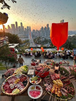#mytravelwrap 
Chongqing Is Basically One Giant La La Land...!!!!! 😭😭

Chongqing really does feel like a massive La La Land — that surreal, romantic, dreamlike quality is spot on.

Why it's a "Giant Lalaland"

· 8D magic terrain: Trains through buildings, stacked overpasses, driving on rooftops, your "1st floor" is actually the 22nd — a real-life Inception.
· Cyberpunk night views: After dark, Hongya Cave's lights reflect on the Jialing River, Qianximen Bridge traffic becomes ribbons of light, the whole mountain city like illuminated building blocks — unreal.
· Cinematic everyday life: Laundry hanging in Baixiangju's old corridors, the Yangtze Cableway slicing across the sky, trains emerging from apartment buildings — market life and magic happening at once.

Lalaland-style photo spots

· Hongya Cave + Qianximen Bridge: The classic. During blue hour (20 min after sunset), lights are fully on and reflections are dreamiest.
· Nanshan Yikeshu: Overlooks the Yuzhong Peninsula — thousands of lights like a spilled galaxy.
· Liziba Monorail Through Building: Wait for a train to emerge from the building against sunset — a surreal Chongqing-only scene.
· Baixiangju: Old residential buildings framing the Yangtze Cableway — everyday life and cinema in one frame.

Tips

· Blue hour is the golden time for night shots — about 20 minutes after sunset, with lingering sky light and lights already on.
· Chongqing's terrain is wild and navigation often fails — asking locals beats maps.

If you want a specific night photography route, just ask.