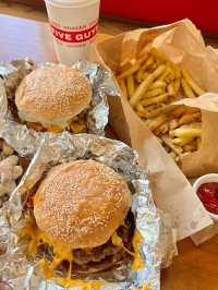 The only thing better than the view? These juicy burgers. 🍔💯 #FiveGuysGenting