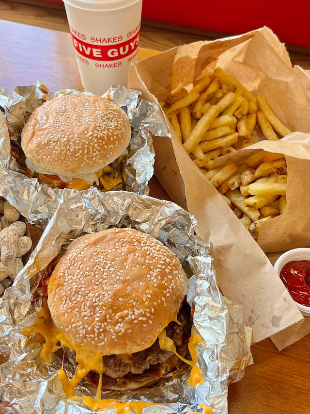 The only thing better than the view? These juicy burgers. 🍔💯 #FiveGuysGenting