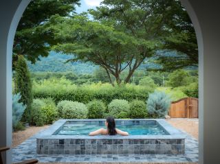 Soak in an onsen amidst the mountains, with the most charming villa!