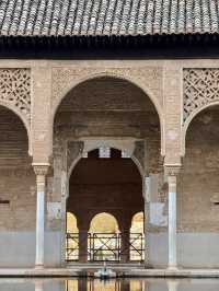 A breathtaking reflection of 5-horseshoe arches over a tranquil pool