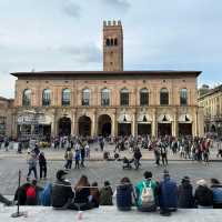 🏛️ “Where Red Brick Breathes: A Pause in Piazza Maggiore”