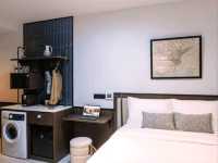 Interiors are clean, minimalist, and smart, featuring comfortable bedding, smart TVs, and en-suite