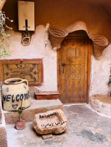 #winterescape Quirky Vibes at Hotel Sidi Idriss 🔮🌞  
Uncover otherworldly architecture and creative vibes in Matmatat-Al-Qadimal, where ancient troglodyte homes meet unexpected pop culture touches! Take your camera—this experience is pure sunshine and outdoor artistry.

Recommended Route:  
Begin at Hotel Sidi Idriss, famous for its cave dwellings and instantly recognizable to "Star Wars" fans. The metal sculptures you spotted outdoors (close-up and sunlit!) make perfect foregrounds for travel portraits—aim for a bright, clear day to highlight their textures against the graffiti wall. Capture wide shots for Instagram-worthy contrast between local heritage and urban art.

Must-Do Activities:  
Explore the underground bunkers that once served as Berber homes (and movie sets). Pause at the painted walls for a dose of contemporary creativity—a fusion of history and street art! Embrace the sun—midday light gives your photos a crisp, vibrant punch.

Photo Spots:  
Best angles: Frame the metal sculptures with the graffiti as backdrop, or take portraits near the cave entrances to spotlight the unique architecture. Close-ups on the metallic surfaces pop beautifully beneath the Tunisian sun!

Visiting Tips:  
Visit between 9:00 AM–11:00 AM or later afternoon for softer light and fewer crowds. Wear comfortable shoes—paths are uneven, and the site is mostly outdoors. Year-round opening from 9:00 AM–6:00 PM makes planning easy.  

Precautions:  
Bring water and sun protection—there’s little shade. Respect local residents and hotel guests (avoid loud photo sessions in private corners). Don’t touch or climb on sculptures—enjoy from a safe distance.

#Tunisia #MatmatatAlQadimal #CulturalLandscape #HotelSidiIdriss #TravelTips