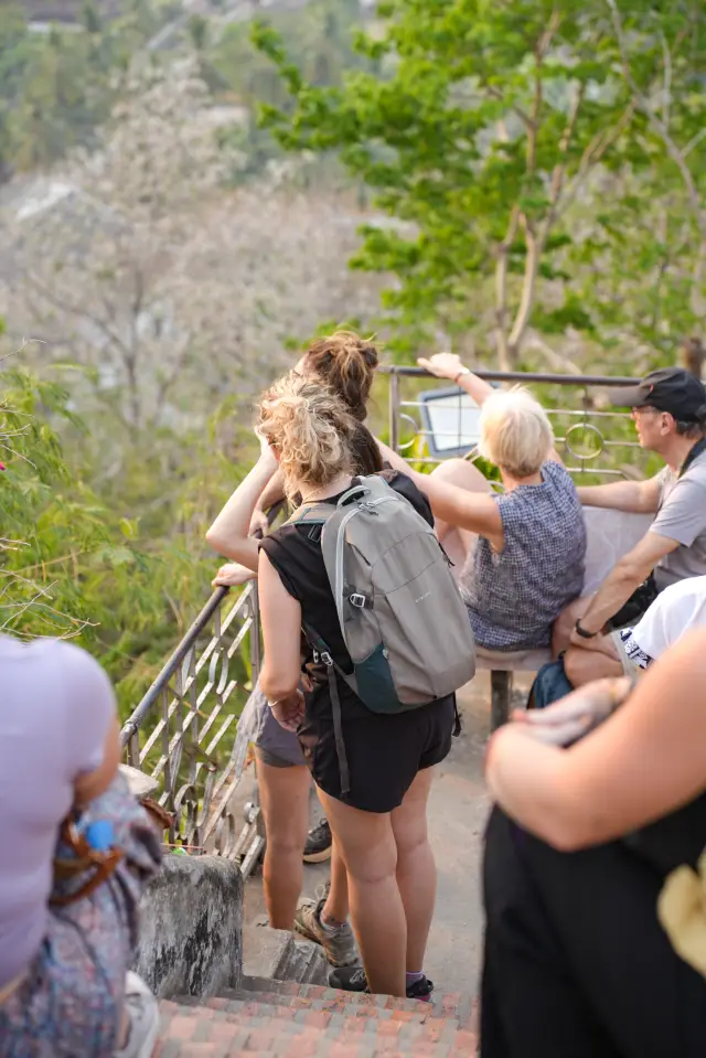 Promise me, if you come to Luang Prabang, you must go to Phousi Hill to watch a sunset