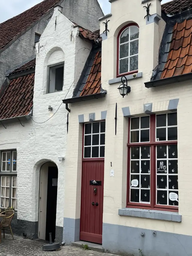 Walking Under the Belfry – Bruges' Church and Alleyways