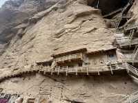 A 1600-year-old site on Yellow River with 183 caves and niches, 694 stone statues