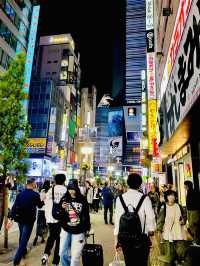 Godzilla and the bustling street of Shinjuku