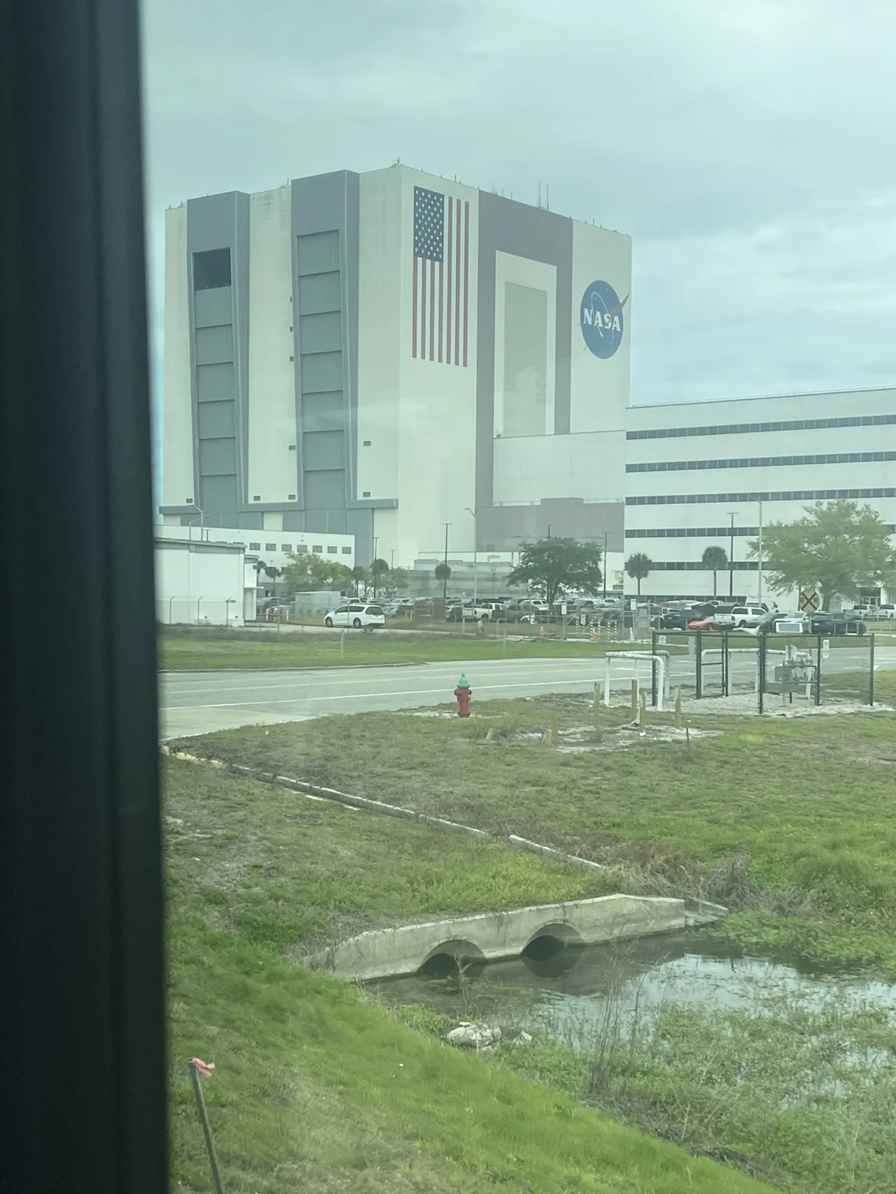 🌟 Blast Off Into History at Kennedy Space Center 🚀👨🚀  
Get ready for an out-of-this-world adventure at Kennedy Space Center, a truly awe-inspiring family must when visiting Florida! Discover lunar legends at the Apollo/Saturn V Center, marvel at cutting-edge science at NASA’s own space center, and snap epic photos beside gigantic rockets—all along Florida’s scenic Space Coast.

🗺️ Itinerary Highlights:  
Start early at the NASA Space Center (H8PX+2P, Kennedy Space Center, FL; open daily 9:00 AM–5:00 PM), where you can geek out at interactive exhibits, see real spacecraft, and maybe even catch a glimpse of astronauts at work! Next, hop aboard the shuttle bus out to the Apollo/Saturn V Center (Kennedy Pkwy N, Titusville), home to the massive Saturn V rocket. The projection shows and moon rock displays are can’t-miss—truly chills-inducing moments!

Don’t forget the Vehicle Assembly Building (Vab Rd, Titusville): while general entry inside is limited, snapping a family photo with this colossal icon in the background is totally insta-worthy! The shuttle bus ride itself is a highlight, with sweeping views of lush waterways, modernist architecture, and natural Florida beauty (spot manatees and eagles if you’re lucky!).

📸 Photo Tips:  
Take your legendary space selfie beneath the Saturn V! Outdoor shots with blue skies and the reflection over the ponds add serious “space explorer” vibes. Snap candid moments on the shuttle bus with the family for a real adventure-in-progress mem!

🧩 Tips & Precautions:  
Arrive when gates open to beat both crowds and the Florida sun. Wear comfy shoes—there's a lot of ground to cover. Stay hydrated and take breaks in shaded pavilions. Some exhibits are outdoors, so sunscreen is a must! Buses to Apollo/Saturn V Center operate all day but check return times.

#KennedySpaceCenter #FamilyTravel #SpaceCoast #FloridaAdventures #MustDo