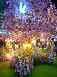 PURPLE FLOWERS AND GLOWING LIGHTS IN SHUNCHENG SHOPPING MALL