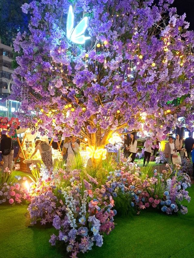 PURPLE FLOWERS AND GLOWING LIGHTS IN SHUNCHENG SHOPPING MALL
